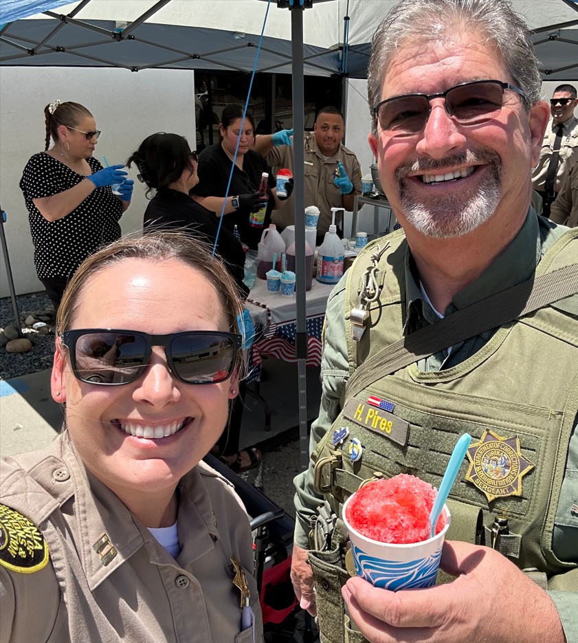 Two employees smiling at Avenal State Prison.