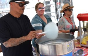 Staff make cotton candy during a special event at Avenal State Prison.