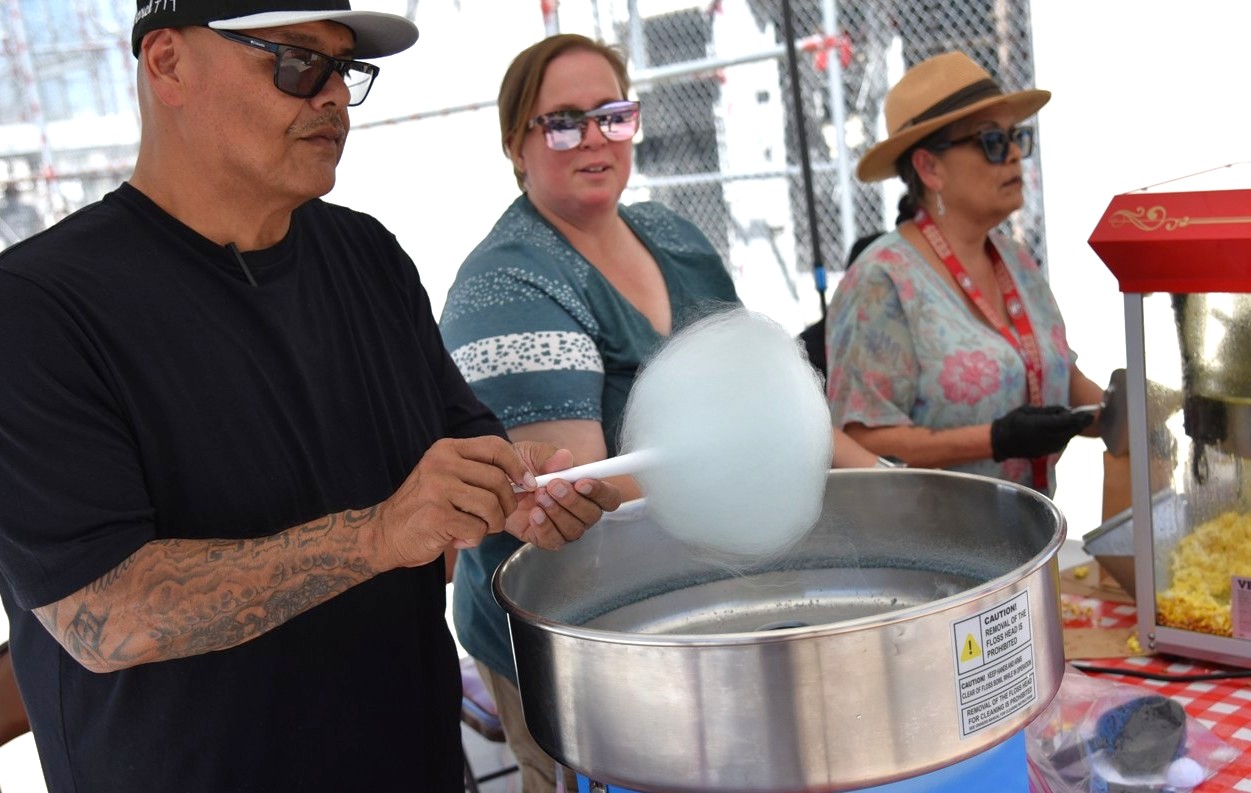 Staff make cotton candy during a special event at Avenal State Prison.