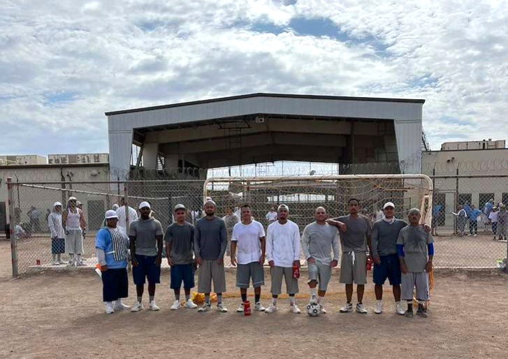 Group photo of incarcerated soccer players at Calipatria State Prison.