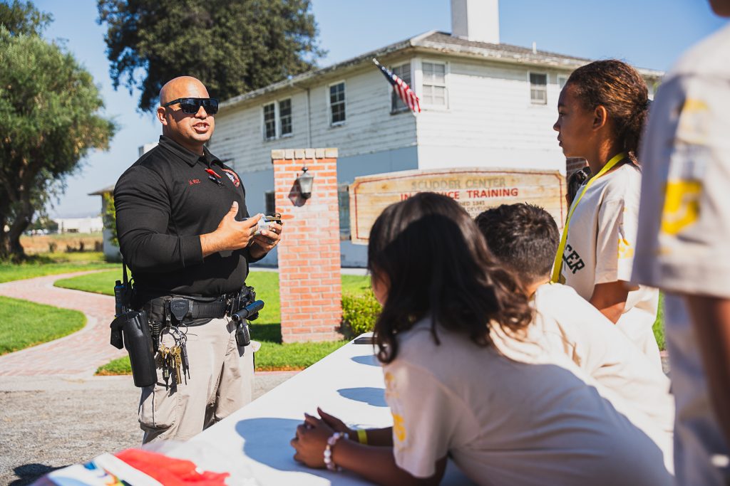 The young cadets learn about correctional officer careers at CIM.