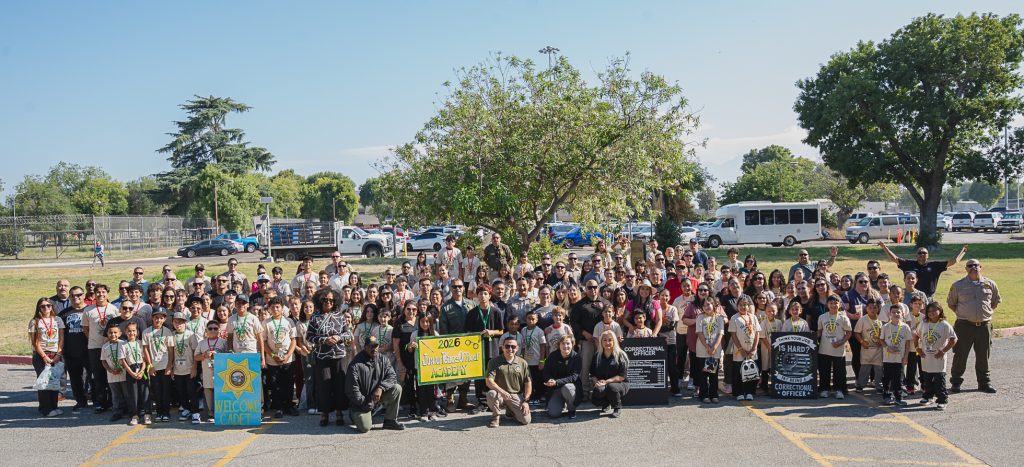 Large group of staff and children at CIM in Chino.