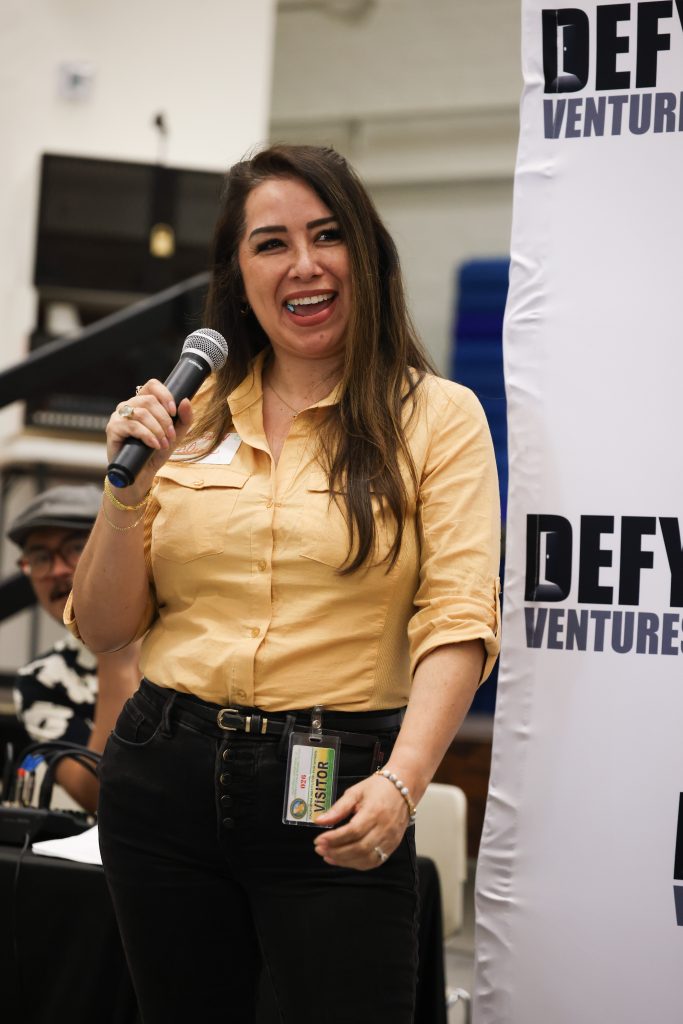 A Defy Ventures volunteer speaks at the CIW event.