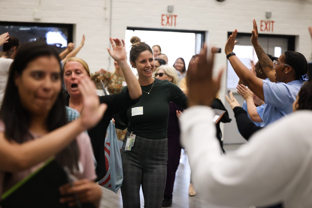 Community volunteers are welcomed by the incarcerated population at CIW.