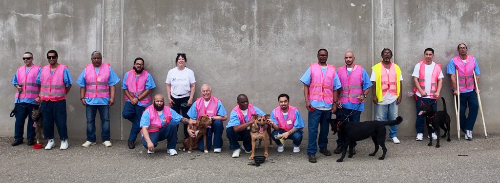 Prison Dog Program participants and dogs at CSP SAC