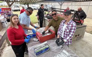 Staff volunteers prepare food at the CTF staff appreciation event.