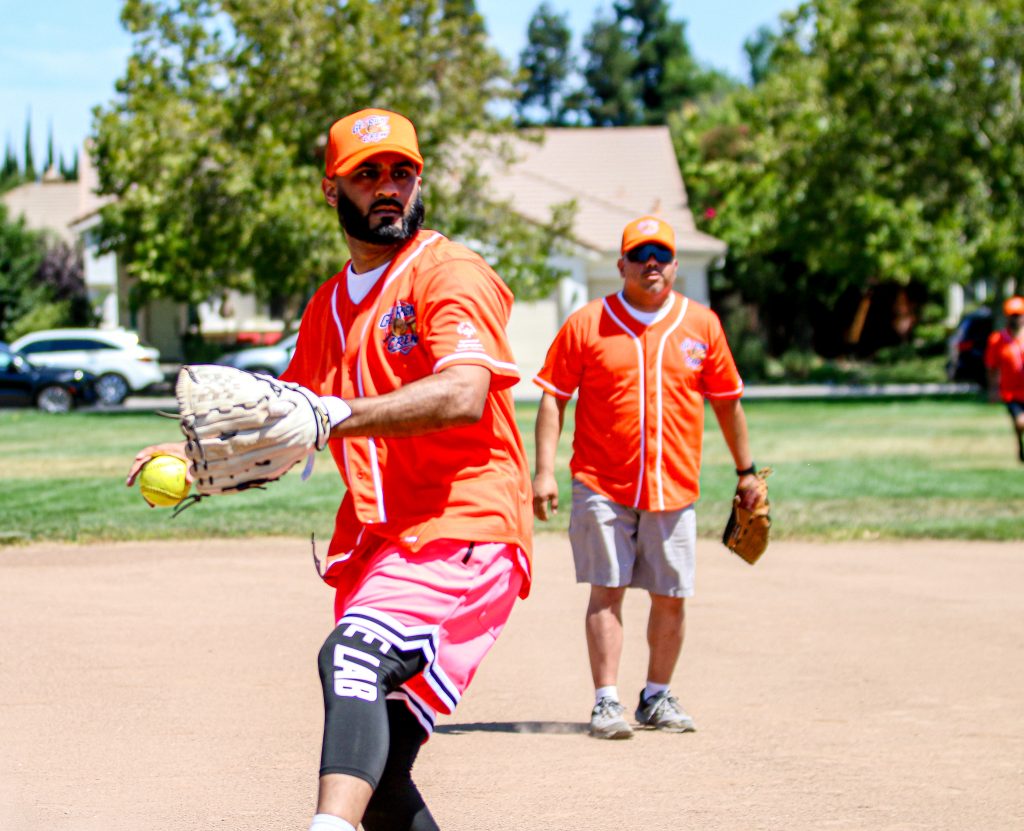 Player begins his pitch during the DAPO softball game. 