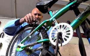 An incarcerated person works on a bike at Folsom State Prison.