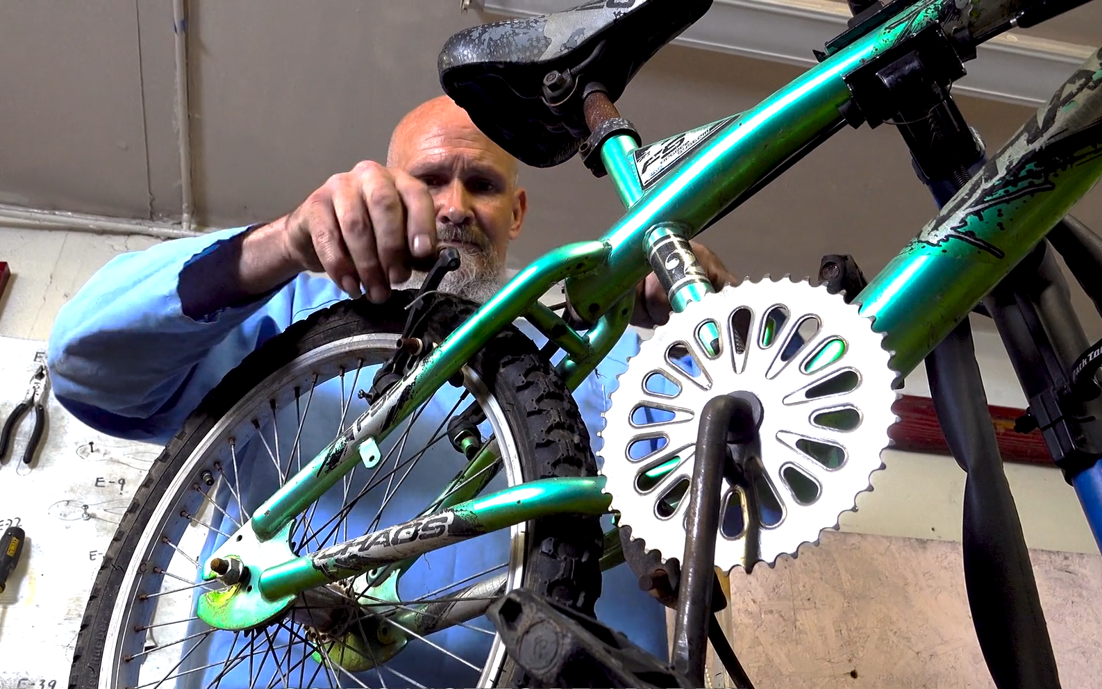 An incarcerated person works on a bike at Folsom State Prison.
