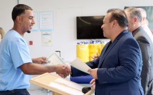 An incarcerated person receives his CCM Pre-Apprenticeship certificate at High Desert State Prison in Susanville, California, July 21, 2026.