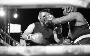 An RJD correctional counselor is shown boxing at Battle of the Badges, held on the deck of the USS Midway Museum.
