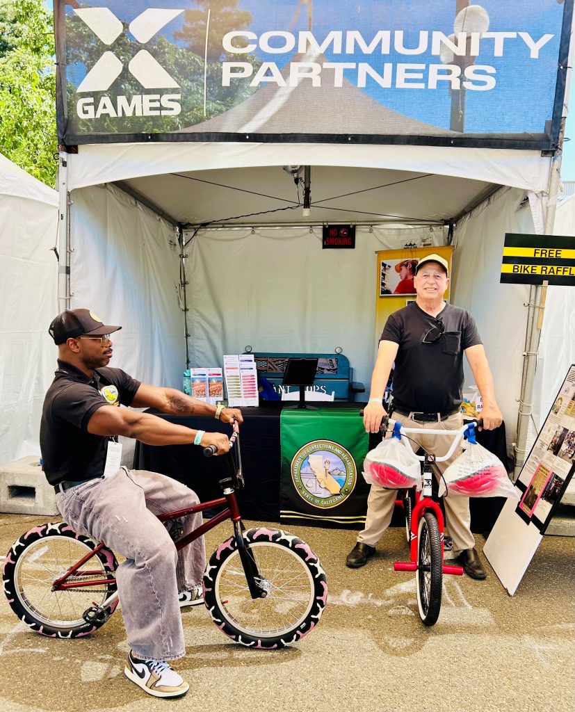 A CMF and recruitment staff member at the X-Games booth in Sacramento.
