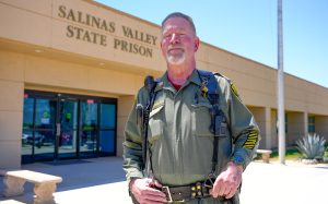 Correctional Officer Scott Lawson stands in front of Salinas Valley State Prison.