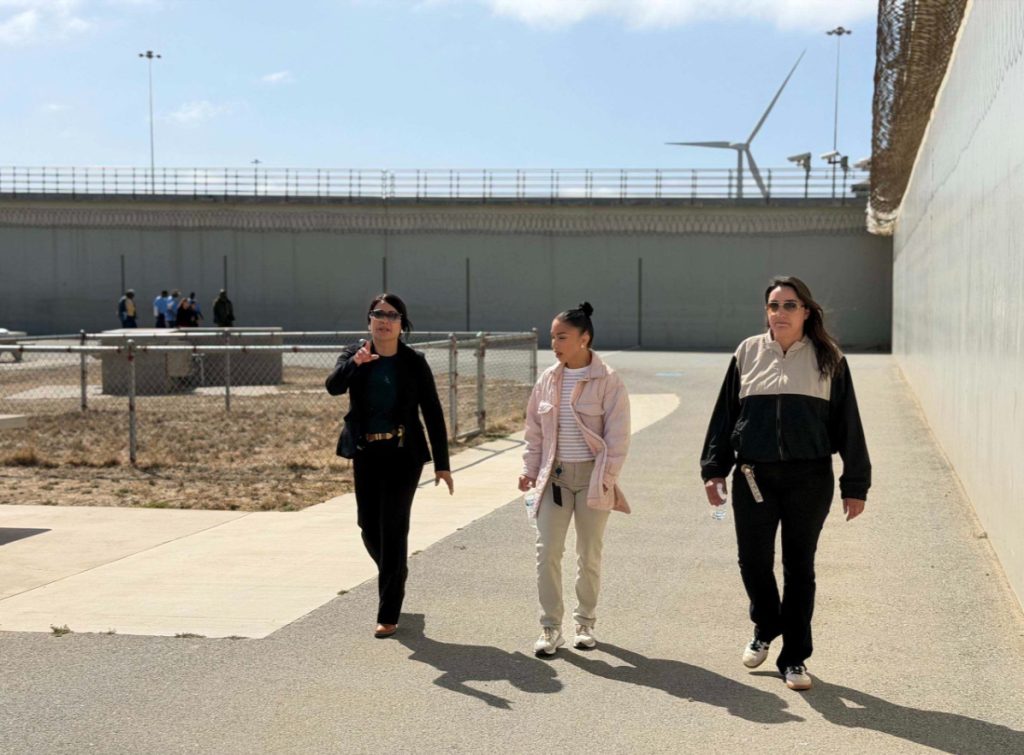 People, incarcerated and staff, walk the track at Salinas Valley State Prison for the first Cancer Awareness Walk held July 2-3.