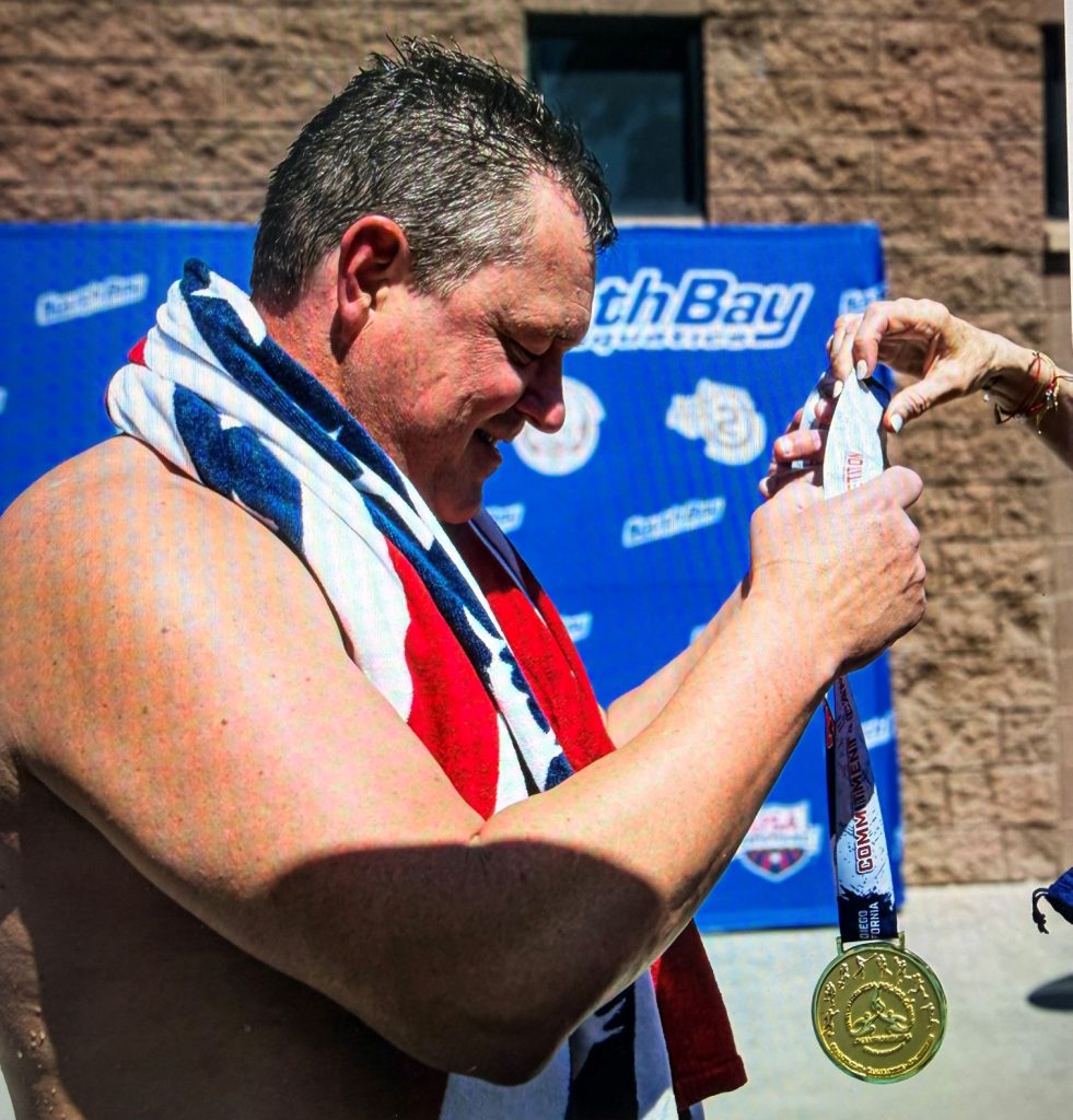 Brock Sheela, nurse practitioner, receives a gold medal at the US Police and Fire Championships in San Diego, California, June 2026.