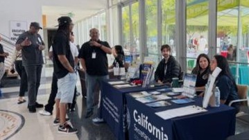 Outreach tables at Compton reentry fair