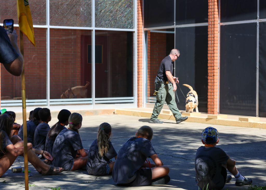 Families learn about the CDCR K-9s during Family Day at the Academy, July 10, 2026, Galt, California.