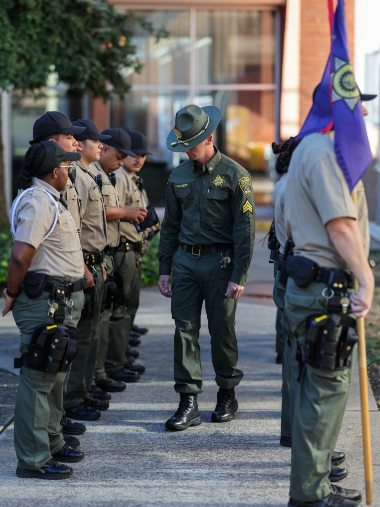 Cadets being inspected by instructor at the Academy