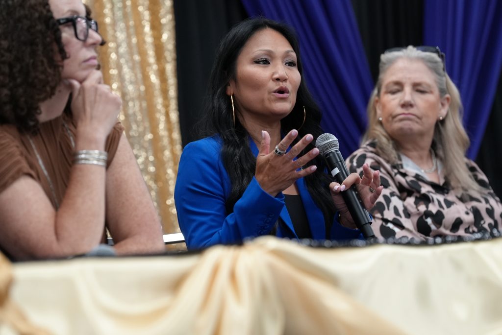 Wendy Enos, a chief deputy administrator with the CDCR Division of Adult Parole Operations, speaks during a panel of women working in law enforcement.