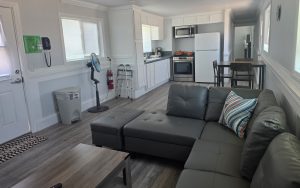 Living room and kitchen area in the new overnight family visiting modular at California Institution for Men in Chino, California.