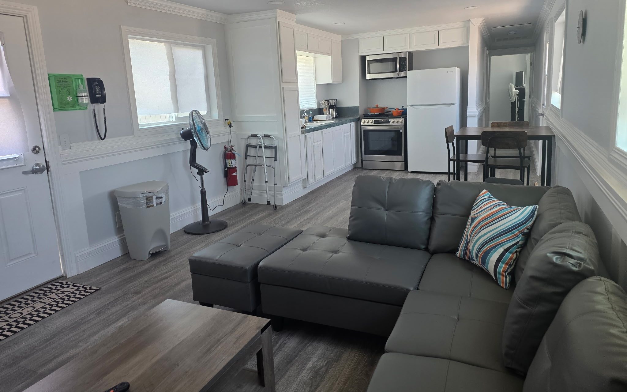 Living room and kitchen area in the new overnight family visiting modular at California Institution for Men in Chino, California.