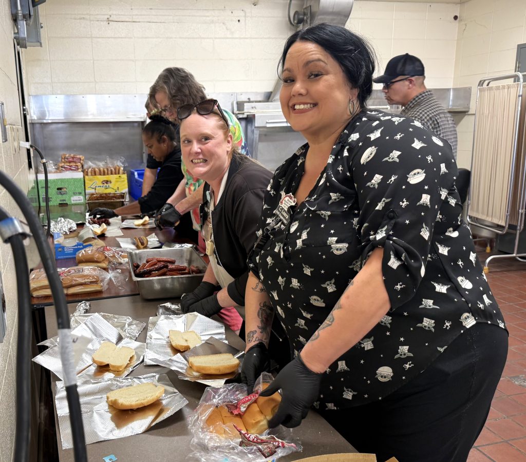 Staff prepare chili dogs for Family Day at California Men's Colony in San Luis Obispo.