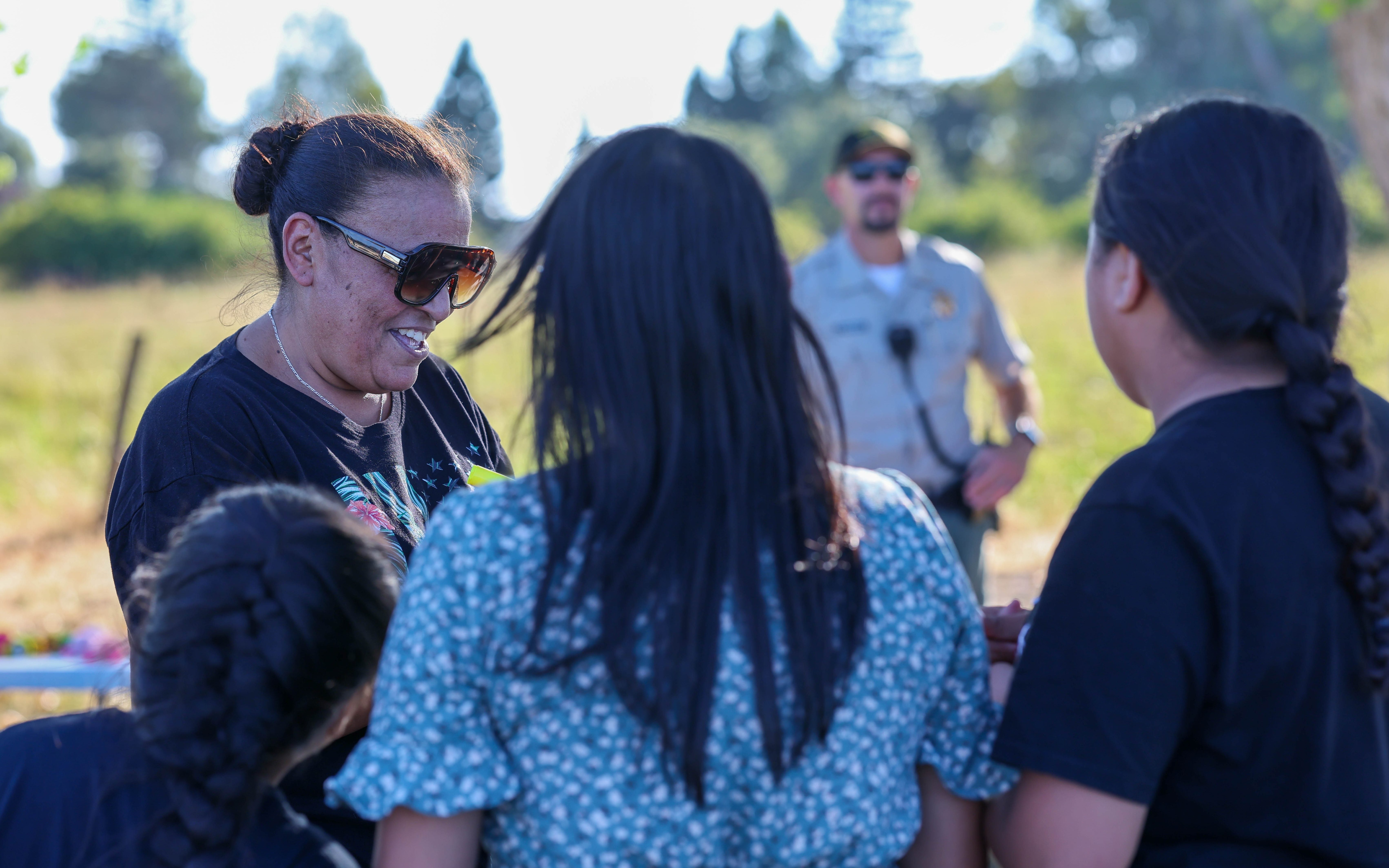 Richard A. McGee Correctional Training Center staff distribute backpacks for children in Galt, California.