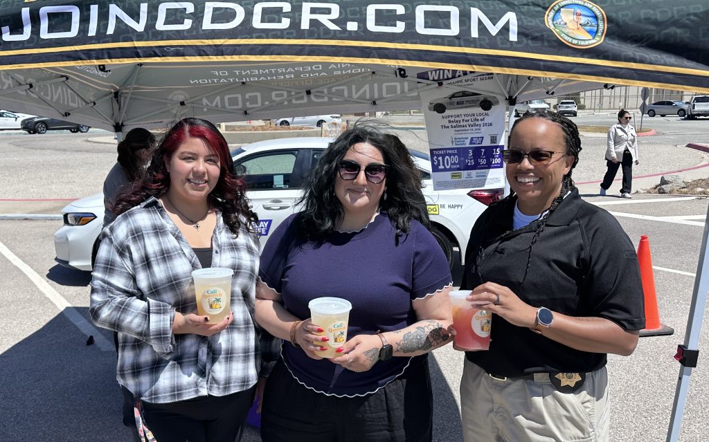 Three staff members with coffee at CTF-Soledad.
