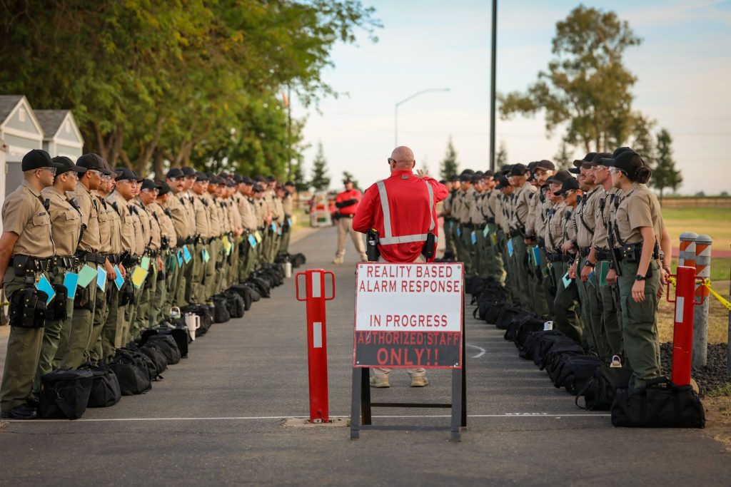A group of cadets prepare to go through alarm response training at the CDCR Academy.