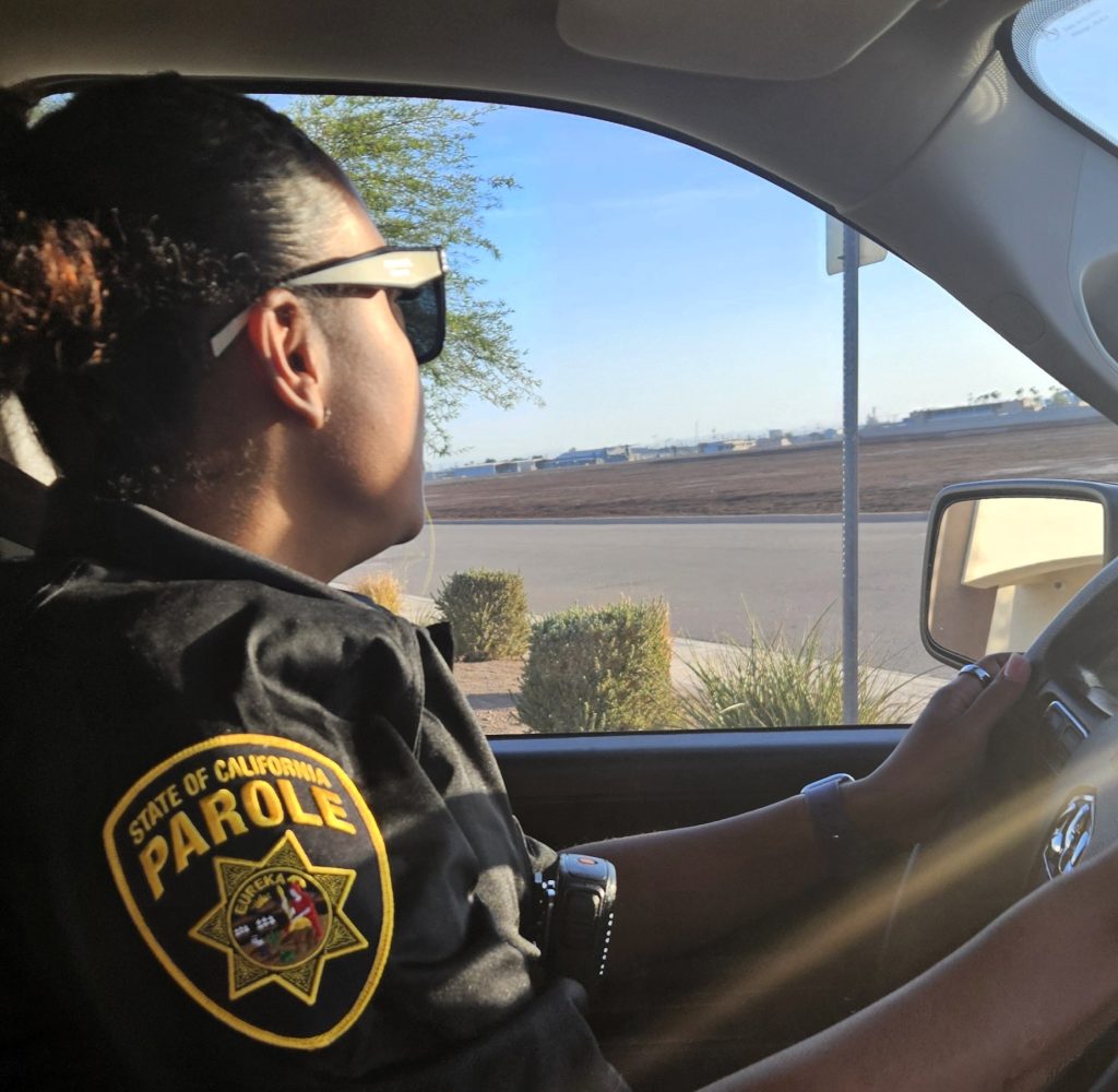 Parole agent driving through neighborhood during Operation Imperial Heat.