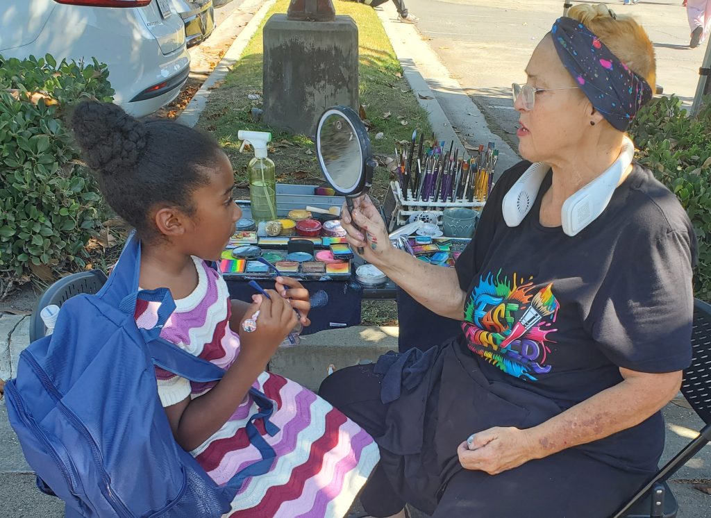 Facepainting at the San Bernardino back-to-school backpack giveaway.