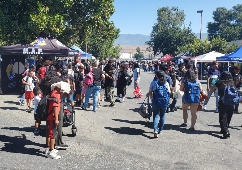 People mill around at the event in San Bernardino.