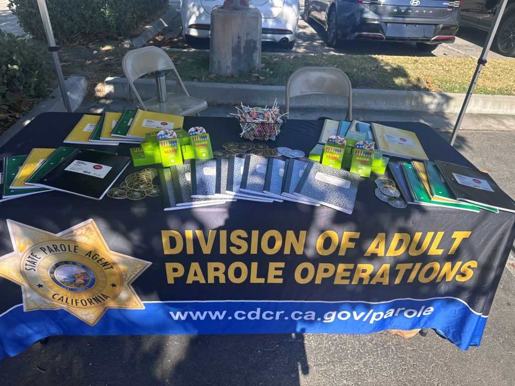 DAPO Community Reentry Unit's backpack giveaway back-to-school booth in San Bernardino.
