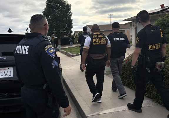 Police and parole agents during Operation Ground Truth.