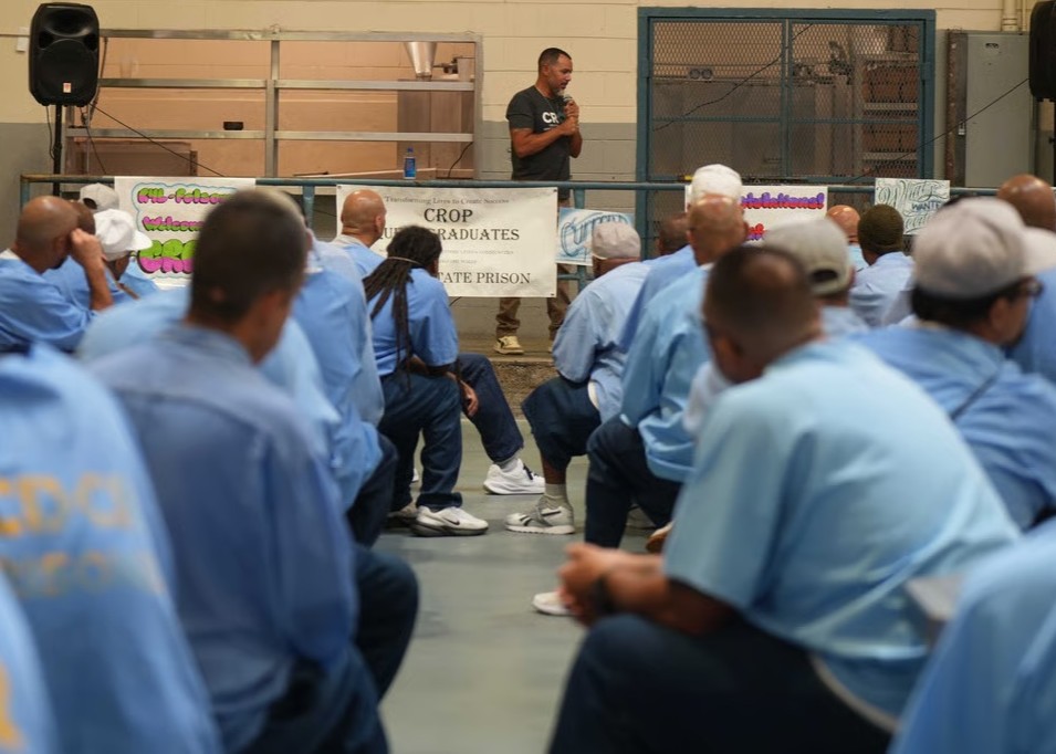 Speaker at graduation of Quest program at Folsom State Prison, photo courtesy of CROP