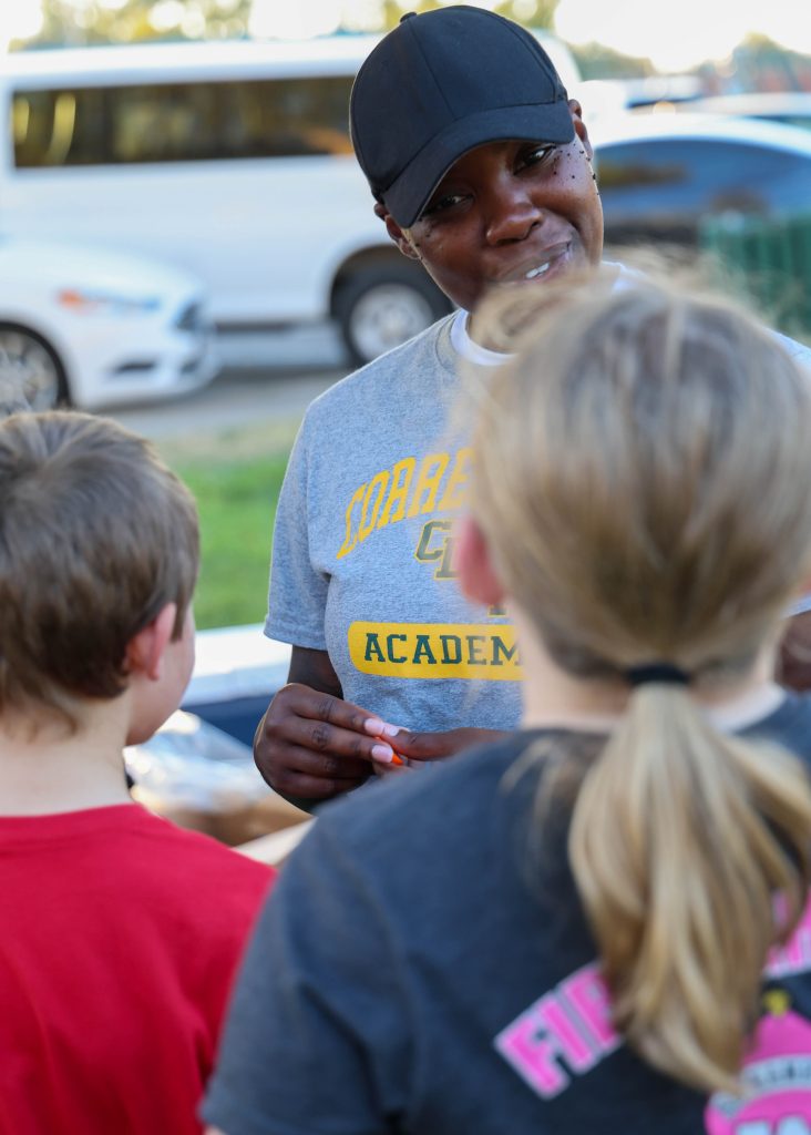 A CDCR cadet interacts with children during Galt's National Night Out.