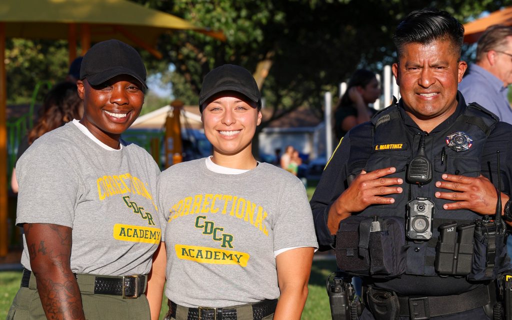 CDCR staff with a Galt police officer at National Night Out in Galt.