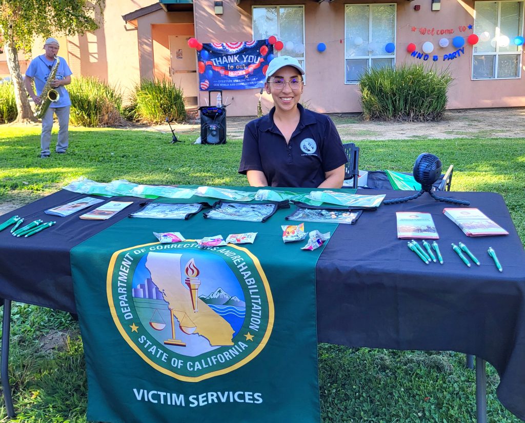 A staff member from Victim Services attends National Night Out in West Sacramento.