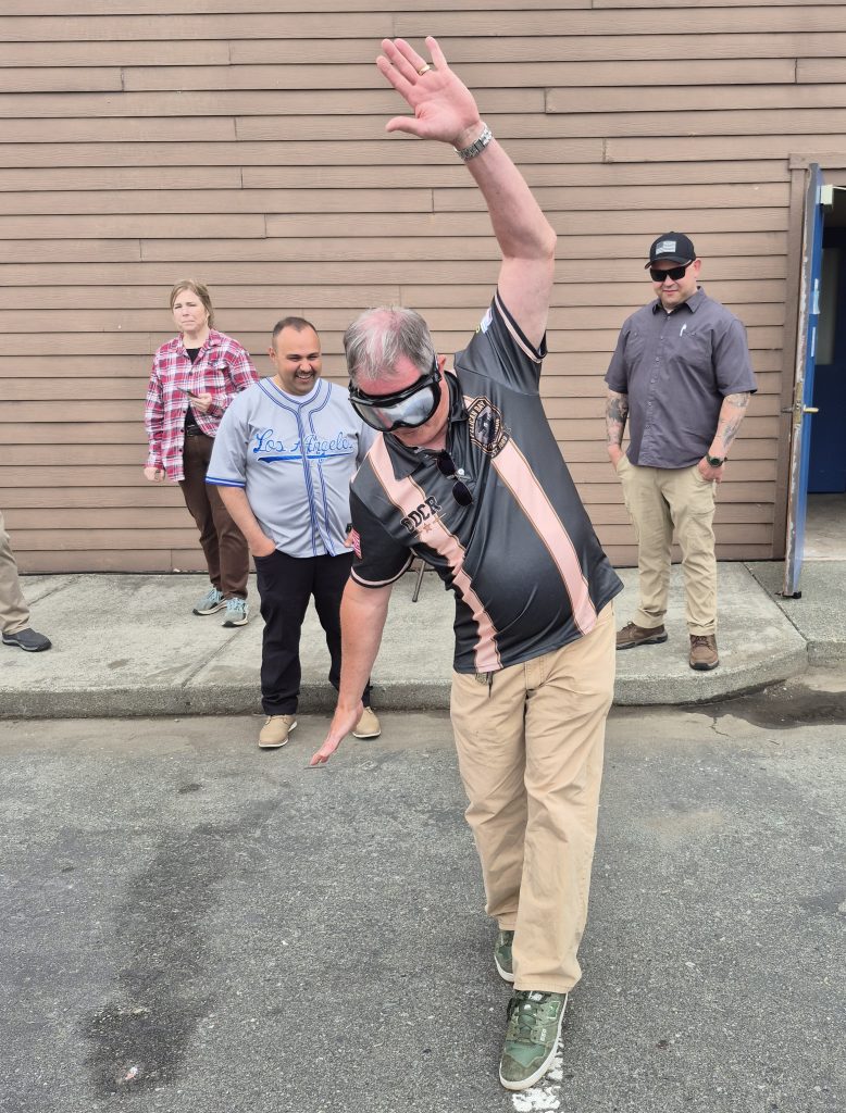 Staff tries to "walk the line" while wearing goggles mimicking the effects of alcohol impairment at Pelican Bay State Prison.