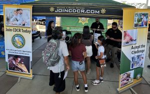 Visitors at the CDCR booth at National Night Out in Natomas.