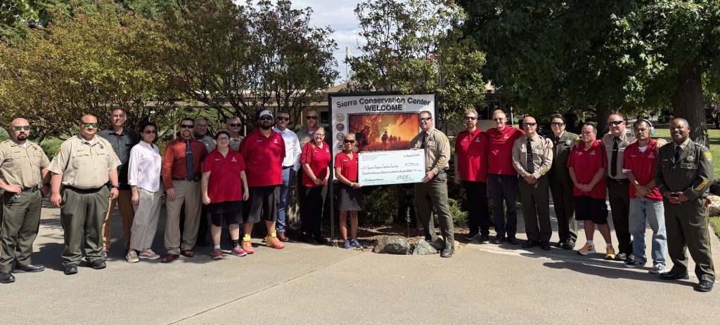 SCC staff with fundraising check for Special Olympics