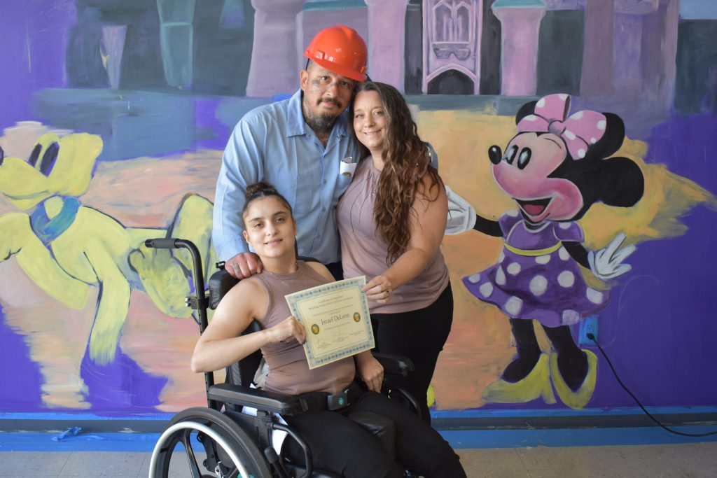 SVSP incarcerated construction program graduates with their families.