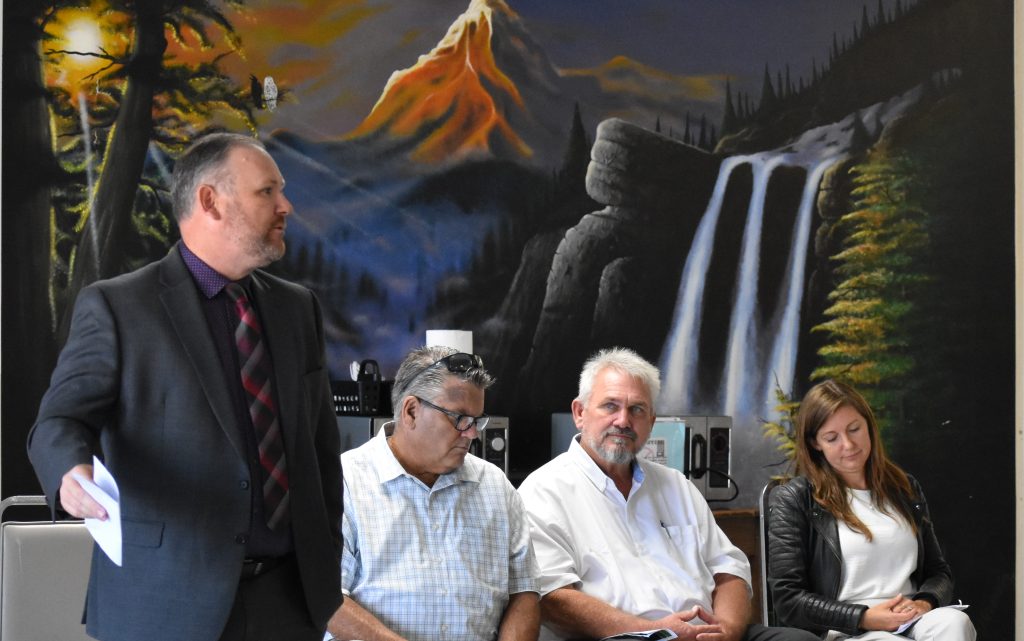 Barton, left, speaks during the SVSP construction program graduation.