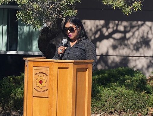 A person speaking to those gathered at WSP-RC to remember two staff members who recently passed away.