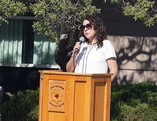 A person speaking at the WSP-RC memorial for two recently passed staff member.