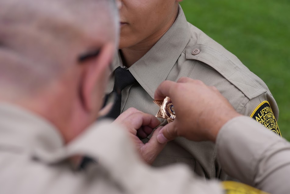 Pinning the badge on a new officer.
