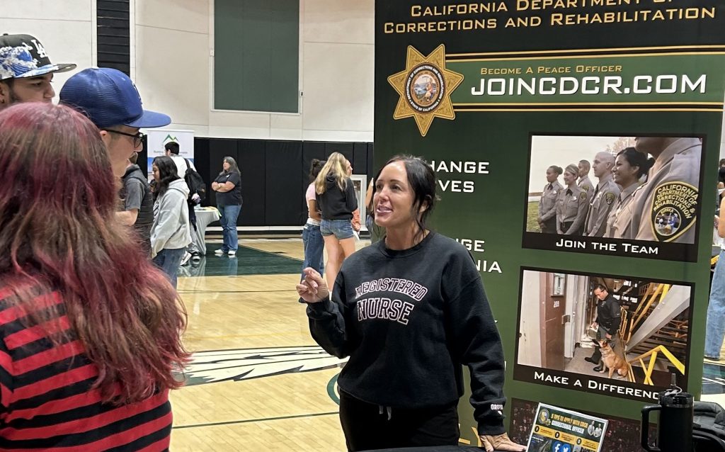 A CCI registered nurse speaks to high school students about career options after they graduate.