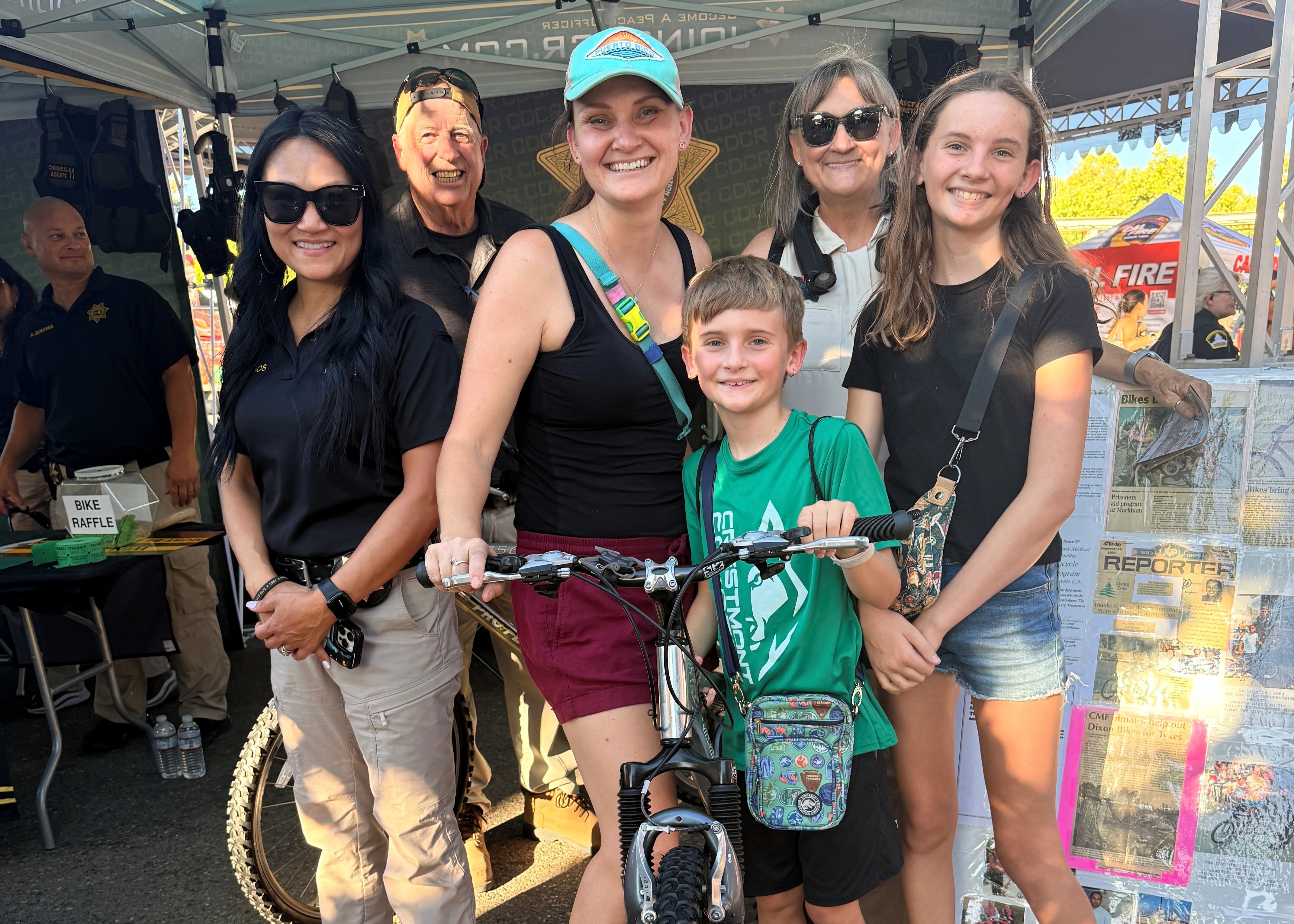 CDCR team with donated bike and attendees at State Fair