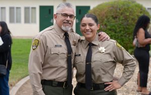 Isabella Espinoza with her recently retired dad, J. Espinoza, at her graduation from the CDCR Academy.