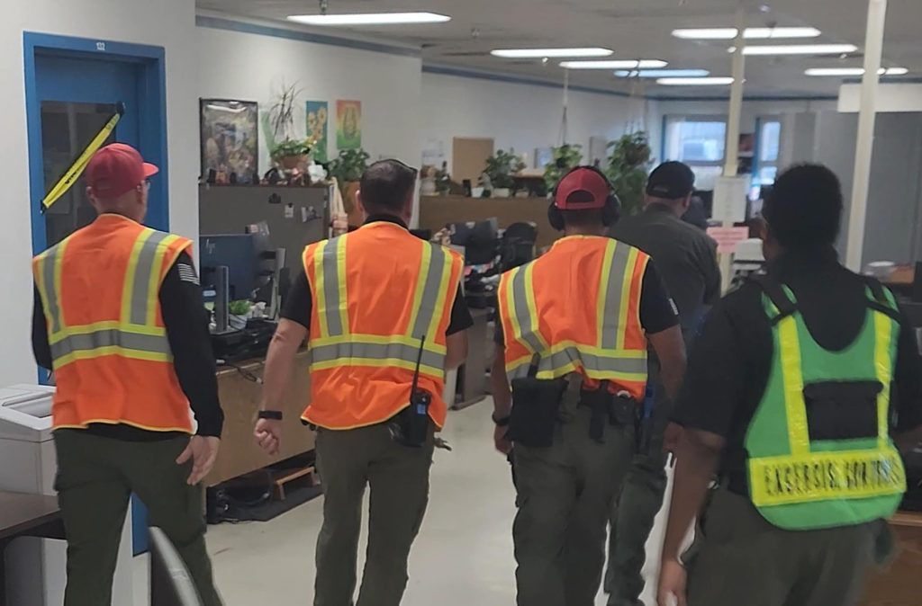 Trainers and observers watch the exercise unfold at High Desert State Prison in Susanville, 2026.